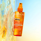 اسپری روغن برنز کننده بیوکسین دارای spf15 حجم 200 میل